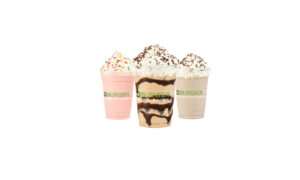 Picture of three shakes topped with whipped cream from BurgerFi